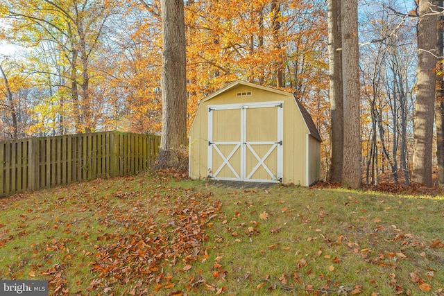 view of outbuilding with a lawn