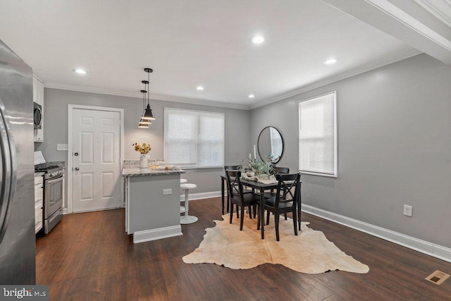 dining room with crown molding and dark wood-type flooring