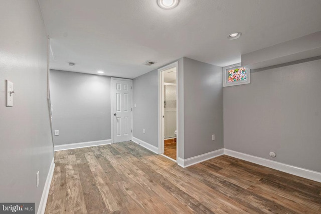 basement featuring hardwood / wood-style flooring