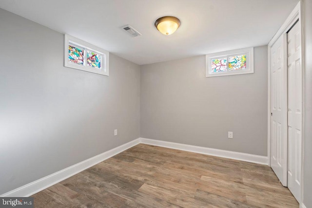 basement with wood-type flooring