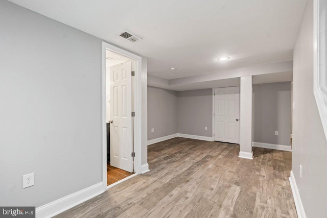 basement featuring light hardwood / wood-style flooring