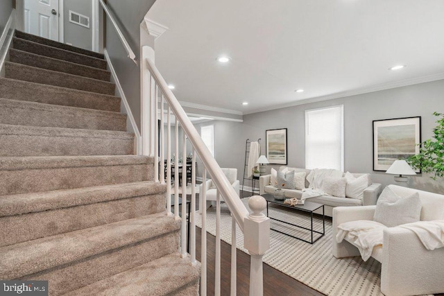 living room featuring dark hardwood / wood-style floors and crown molding