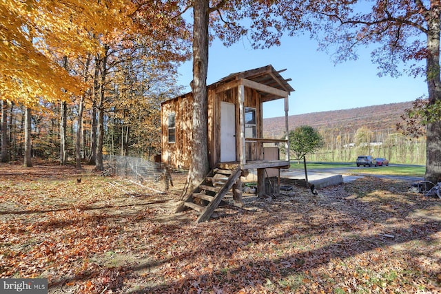 view of jungle gym with a shed