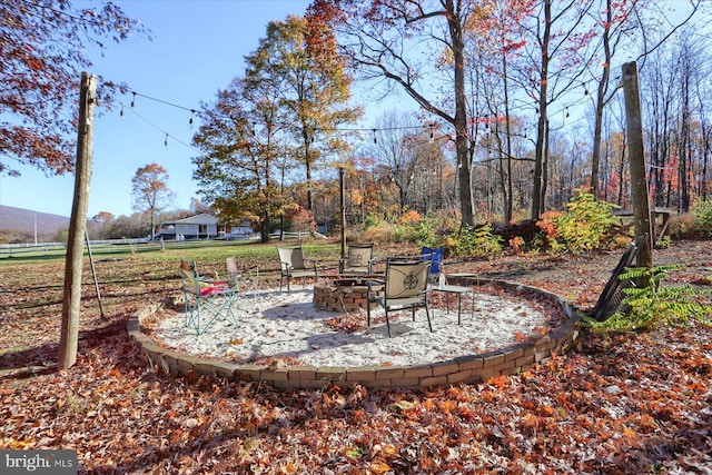 view of yard with an outdoor fire pit