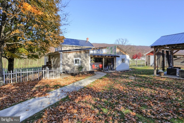 exterior space featuring an outbuilding and a mountain view