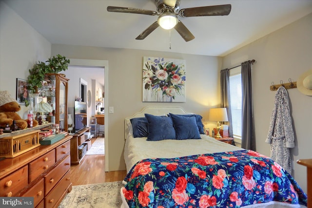 bedroom featuring ceiling fan and light hardwood / wood-style flooring