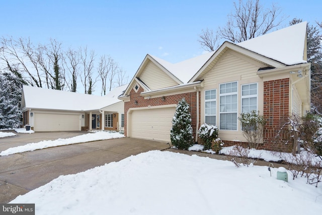 ranch-style home with brick siding, concrete driveway, and an attached garage