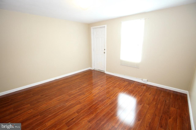 spare room featuring hardwood / wood-style floors