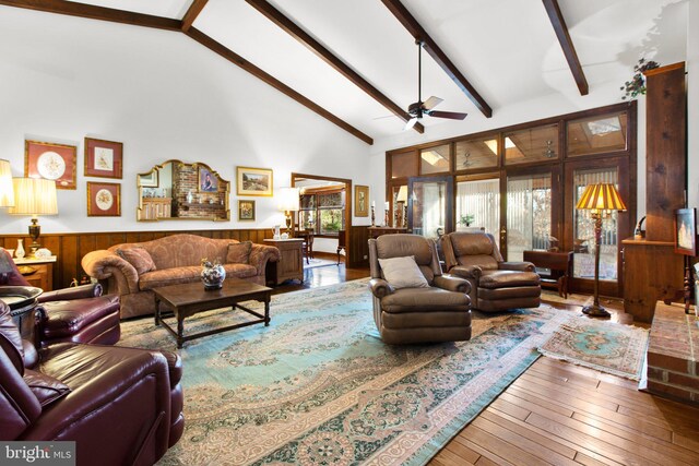14445 Kings Grant Ln, Doswell, VA 23047 - living room featuring a ceiling fan, a wainscoted wall, high vaulted ceiling, beamed ceiling, and hardwood / wood-style floors