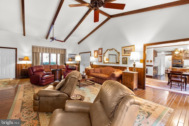 living room with beam ceiling, ceiling fan, high vaulted ceiling, and light wood-type flooring