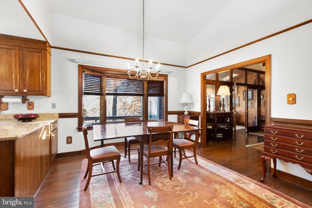 14445 Kings Grant Ln, Doswell, VA 23047 - dining space with a chandelier, wood-type flooring, lofted ceiling, and wainscoting