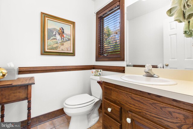 14445 Kings Grant Ln, Doswell, VA 23047 - half bathroom featuring tile patterned floors, toilet, vanity, and baseboards