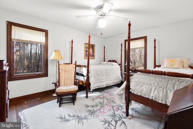 bedroom featuring dark hardwood / wood-style floors and ceiling fan