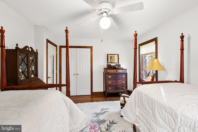 bedroom with ceiling fan and dark hardwood / wood-style flooring