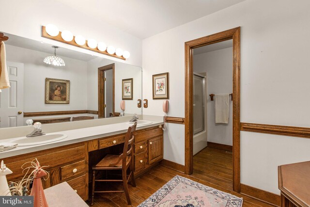 14445 Kings Grant Ln, Doswell, VA 23047 - full bathroom with wood finished floors, double vanity, a shower with shower door, a chandelier, and a bath