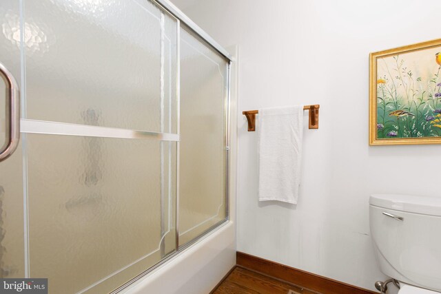 14445 Kings Grant Ln, Doswell, VA 23047 - full bathroom featuring baseboards, shower / bath combination with glass door, toilet, and wood finished floors