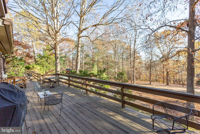 wooden deck with area for grilling