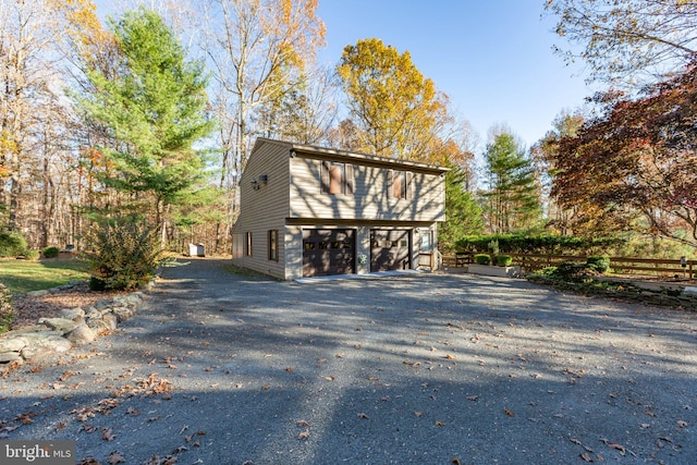 view of side of home with a garage