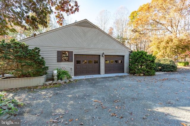 view of side of home featuring a garage