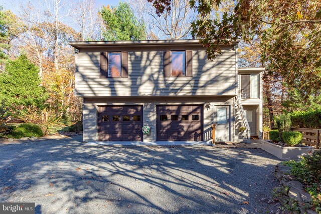 14445 Kings Grant Ln, Doswell, VA 23047 - view of property exterior with an attached garage and driveway