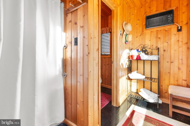 bathroom with wooden walls