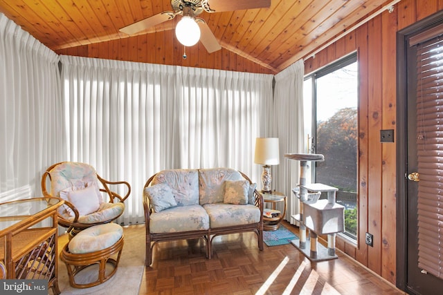 living area with ceiling fan, parquet floors, wooden ceiling, and vaulted ceiling