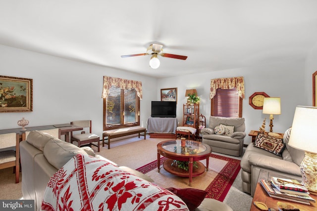 living room featuring light carpet and ceiling fan