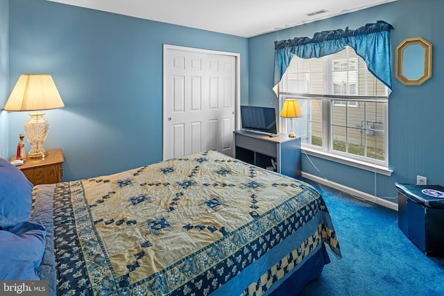 carpeted bedroom featuring a closet