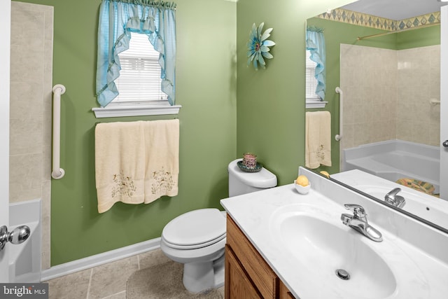 bathroom featuring tile patterned flooring, vanity, and toilet