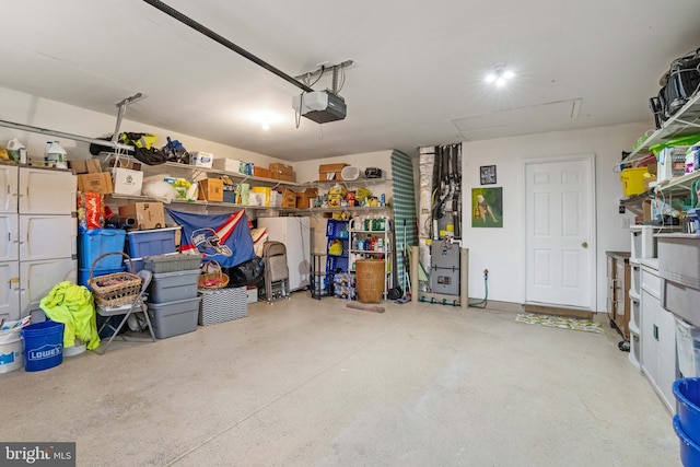 garage with refrigerator and a garage door opener