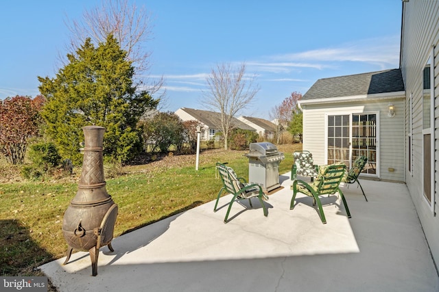 view of patio featuring a grill