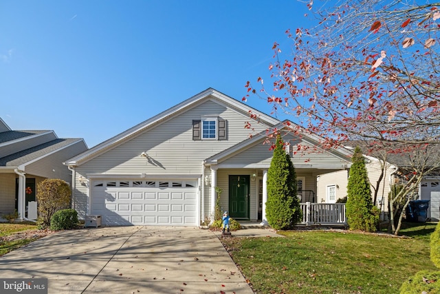 view of property with a garage, a porch, and a front yard