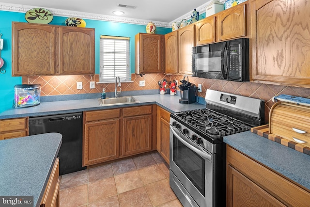 kitchen with black appliances, light tile patterned flooring, sink, and tasteful backsplash