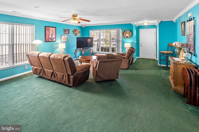 living room with ceiling fan, crown molding, and dark colored carpet