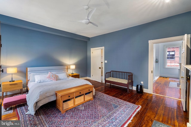 bedroom with ceiling fan and dark wood-type flooring