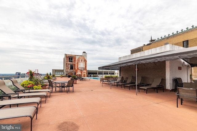 view of patio featuring a community pool