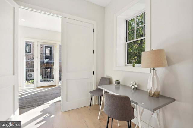 office with light hardwood / wood-style floors