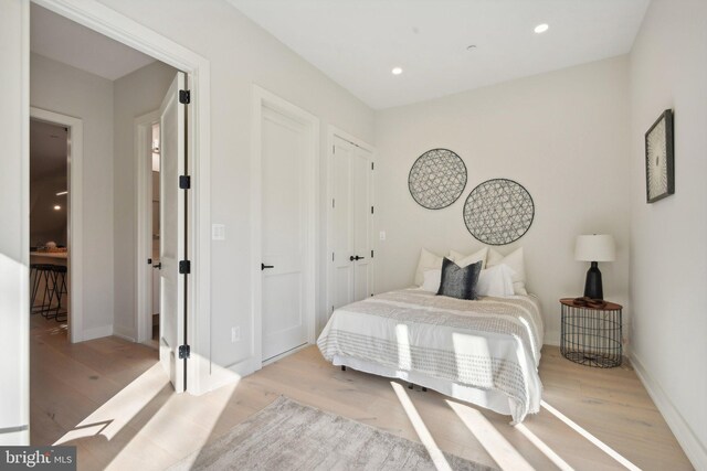 bedroom with light wood-type flooring