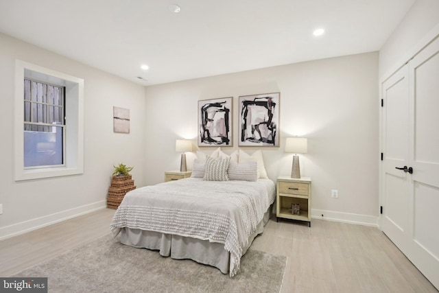 bedroom with light hardwood / wood-style flooring