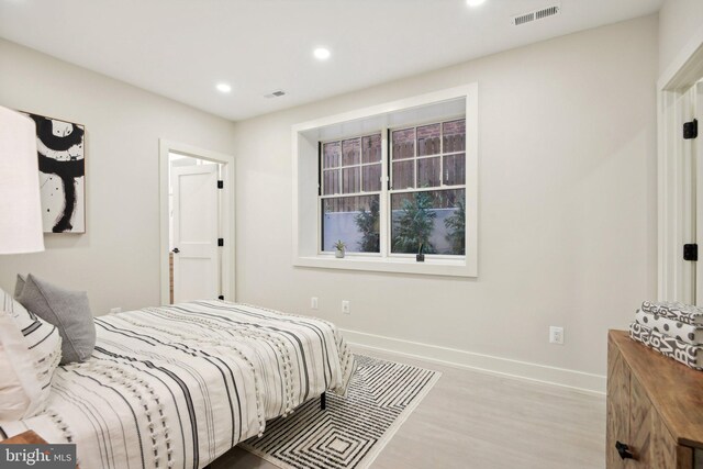 bedroom with light hardwood / wood-style flooring