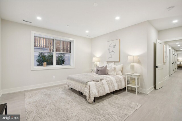 bedroom featuring light wood-type flooring