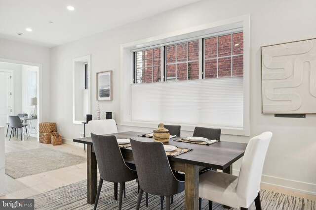 dining area featuring wood-type flooring