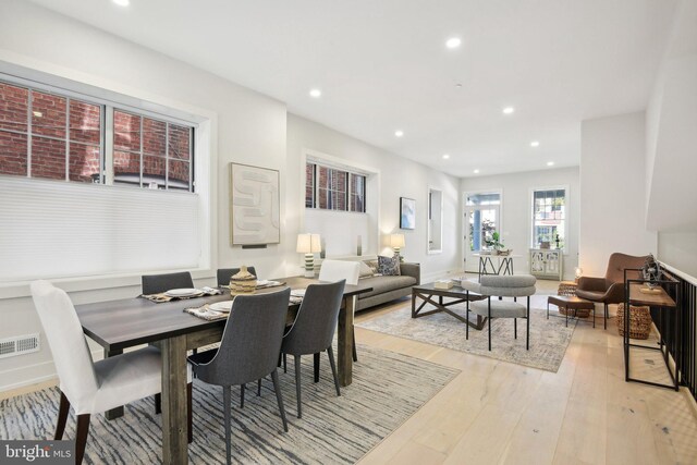 dining space with light wood-type flooring