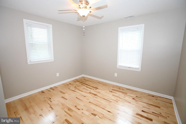 unfurnished room with light hardwood / wood-style flooring and ceiling fan