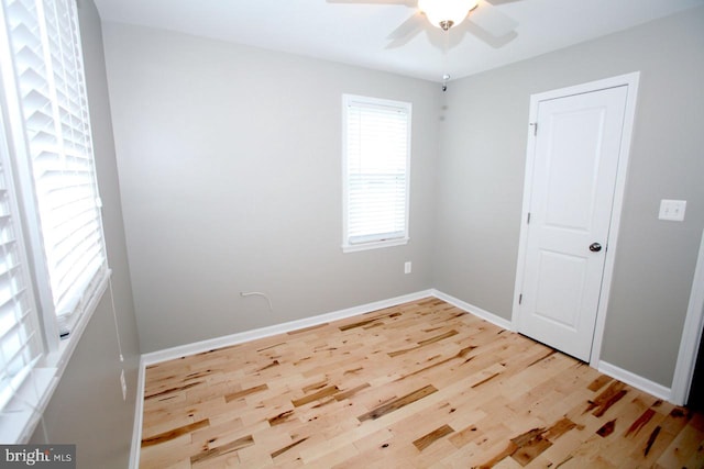 unfurnished room featuring hardwood / wood-style floors and ceiling fan