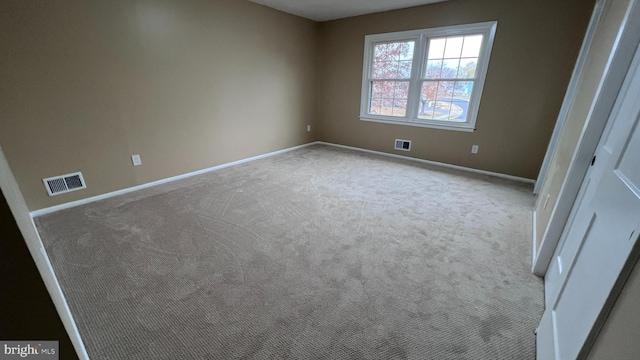 unfurnished room with light carpet