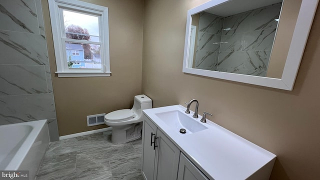 bathroom featuring vanity and toilet