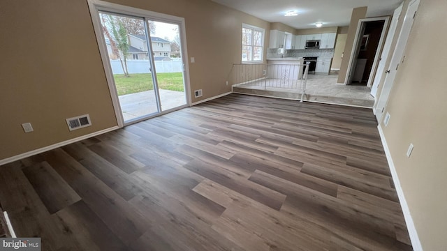 unfurnished living room featuring hardwood / wood-style floors