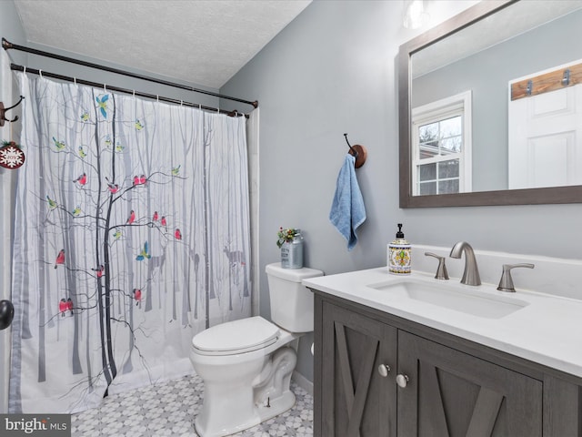 bathroom with vanity, a shower with curtain, a textured ceiling, and toilet