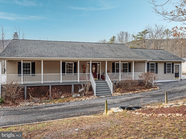 ranch-style home featuring a porch